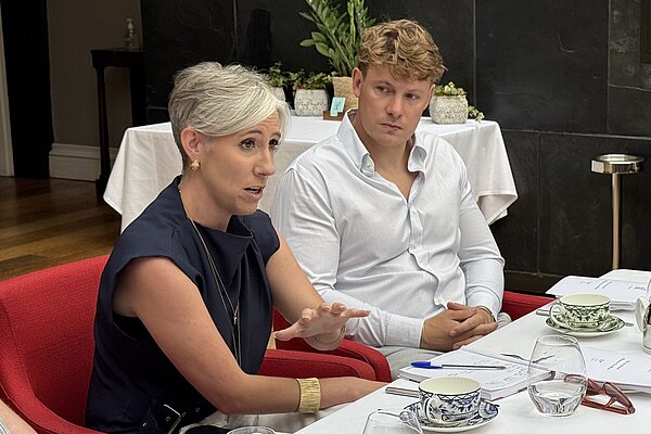 Cllr Carl Cashman and Daisy Cooper speaking with hospitality businesses
