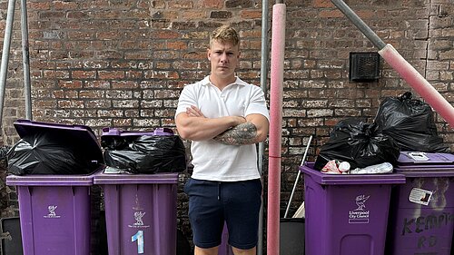 Carl Cashman in front Bins