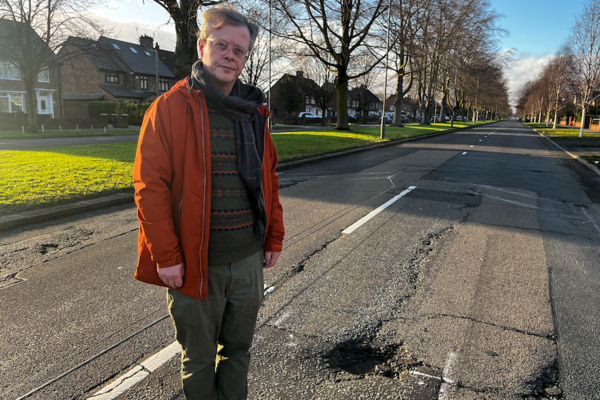 Allerton councillor Andrew Makinson inspecting Mather Avenue potholes